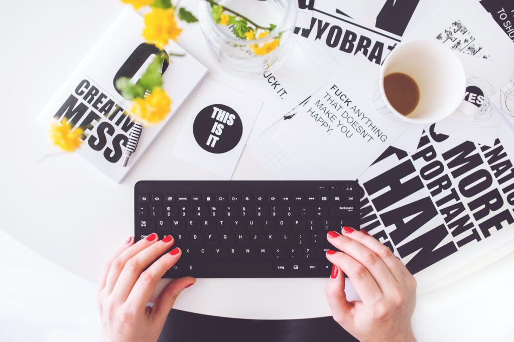 https://www.pexels.com/photo/girl-writing-on-a-black-keyboard-6469/