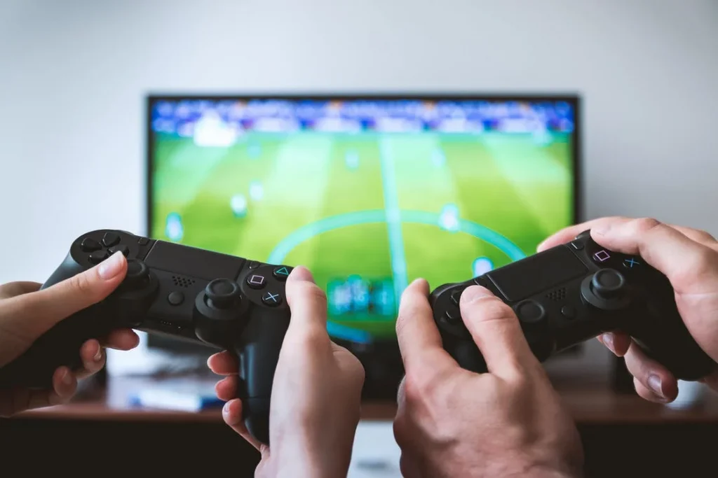 2 Games consoles playing football, online gaming